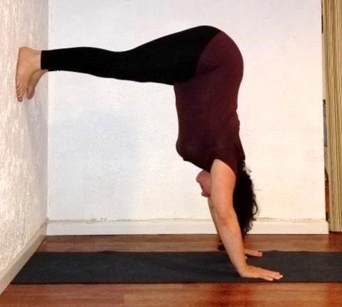 Adho Mukha Vrksasana (Handstand) with a wall also 3-legged dog